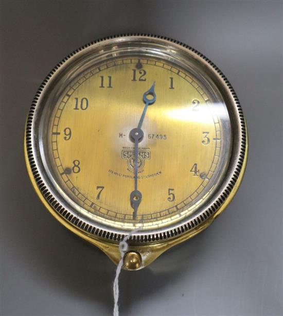 An early 20th century Smiths brass automobile timepiece, diameter 9cm